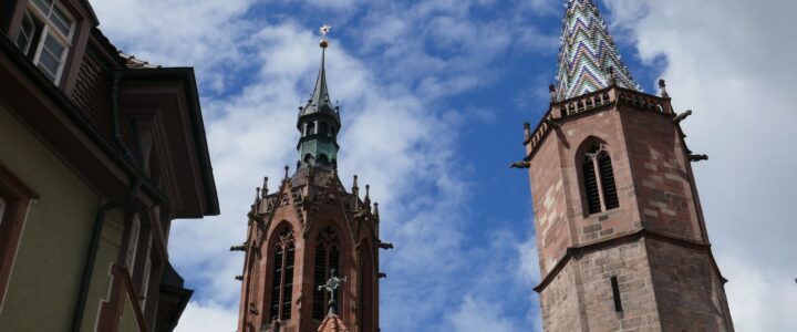 a tall tower with a clock on the top of it Villingen-Schwenningen